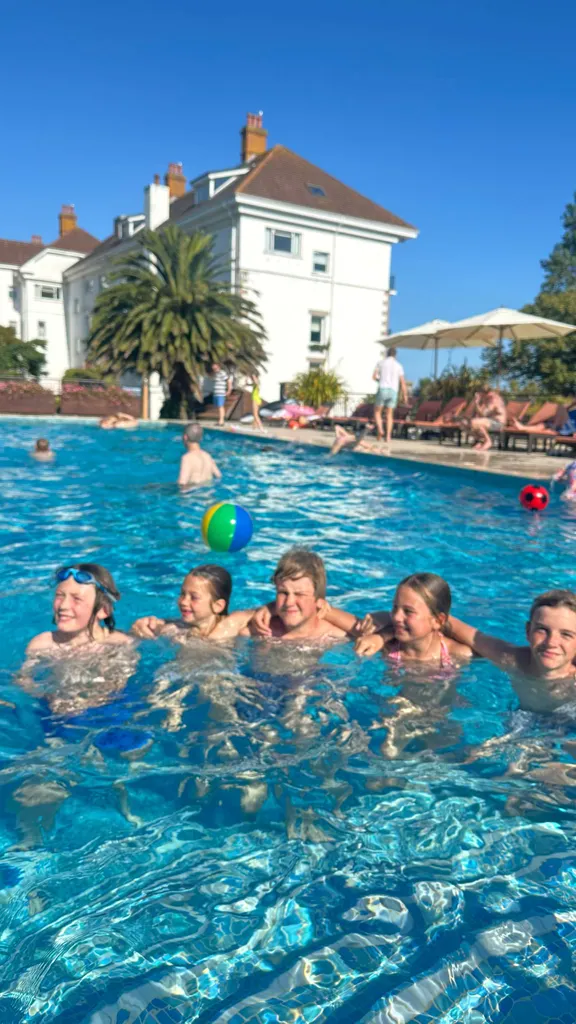 Group of kids having fun in Jersey's swimming pool